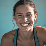 Woman in sports bra smiling at camera